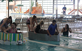 SUCCESS students getting ready for the cardboard and duct tape boat race